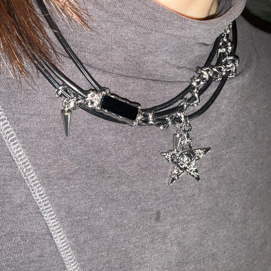 Necklace with star charm on a gray background
