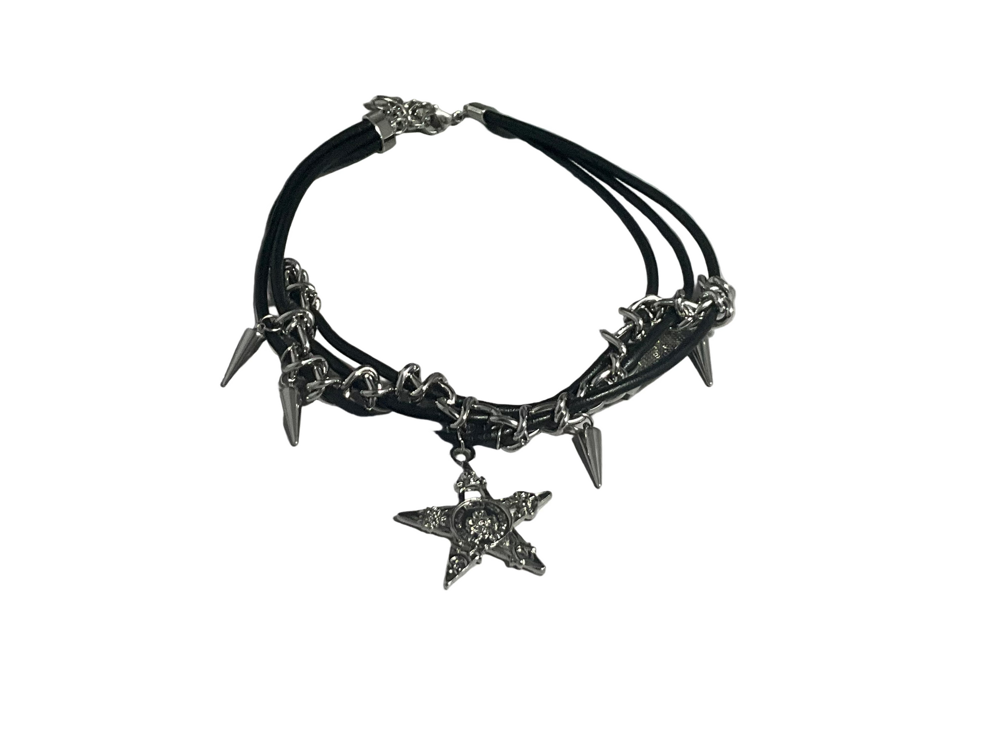 Black leather choker necklace with silver spikes and star charms on a light gray background