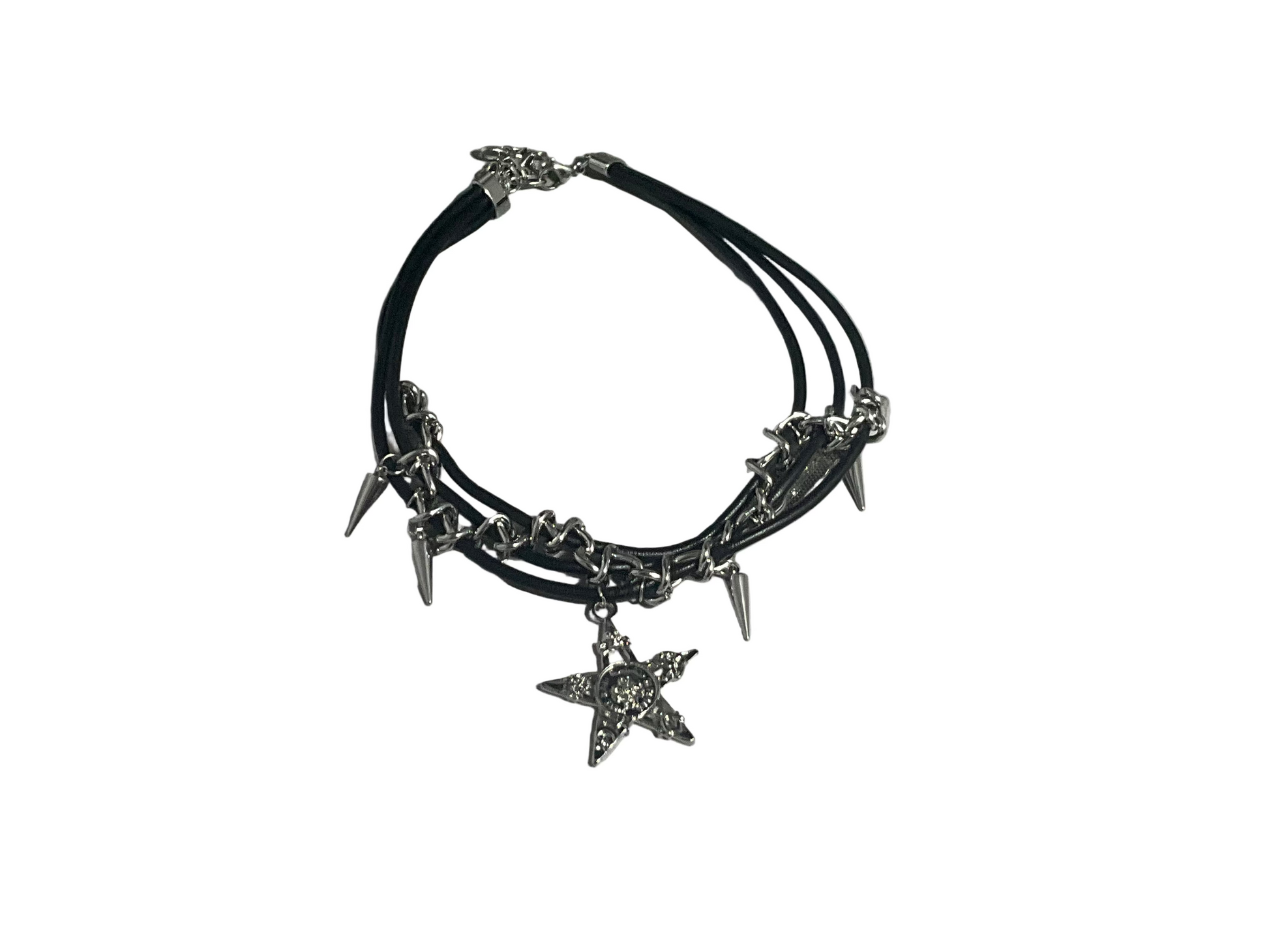 Black leather choker necklace with silver spikes and star charms on a light gray background