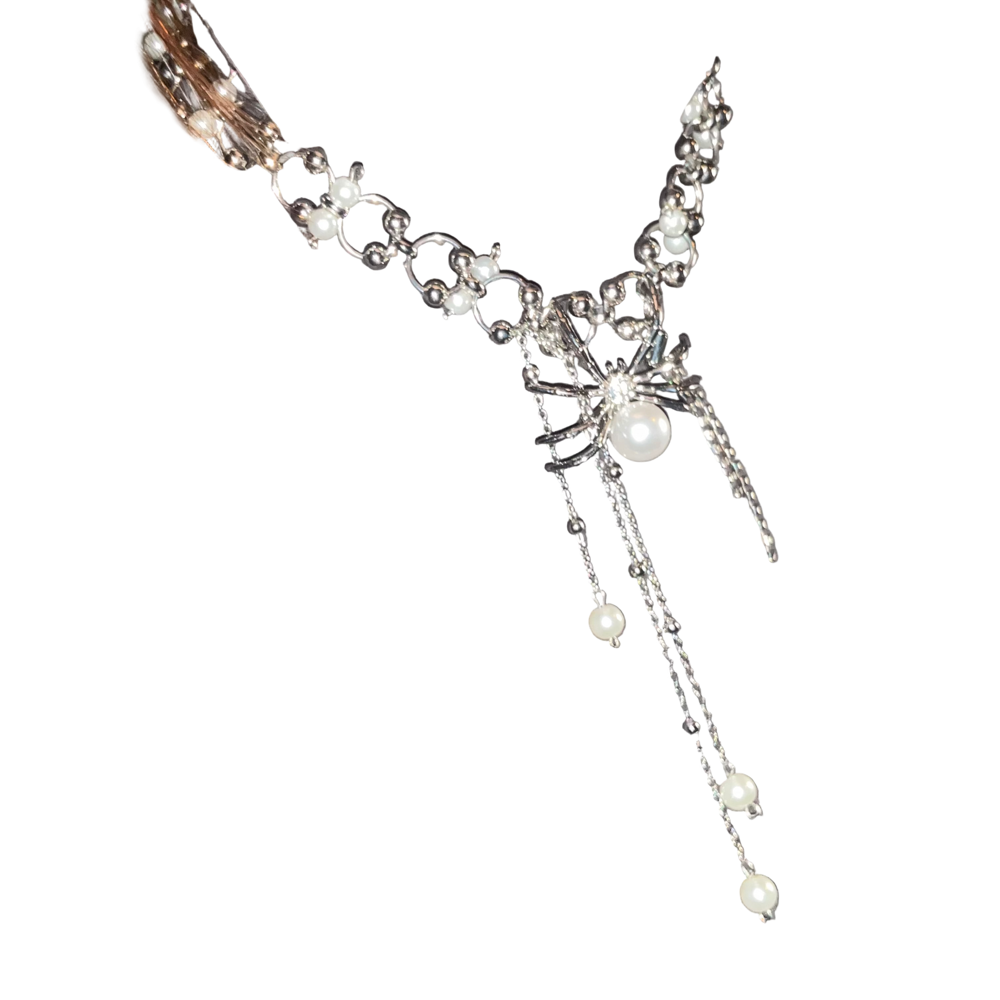 Necklace with pearls and crystals on a gray sweater